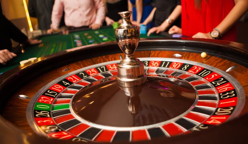 people playing at the roulette table